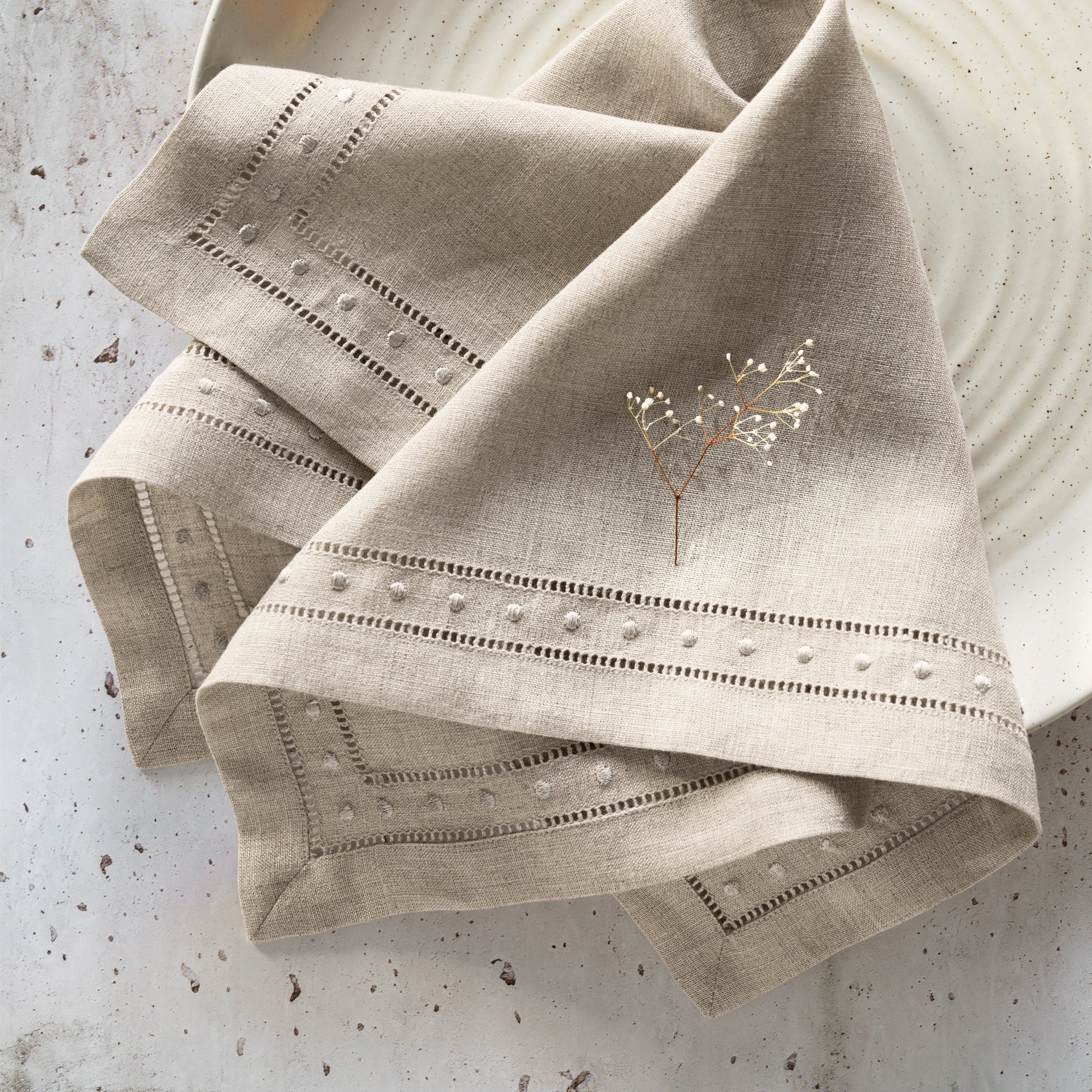 natural linen napkins with double hemstitch and Swiss dot embroidery are handcrafted from French linen
